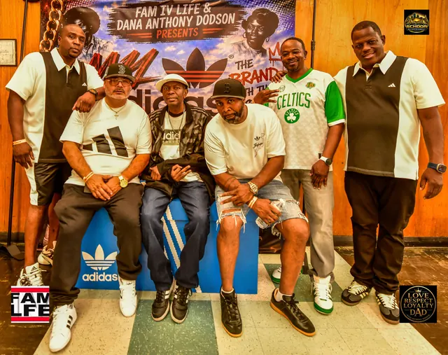 Six friends posed in front of the FAM IV LIFE and Dana Anthony Dodson adidas banner
