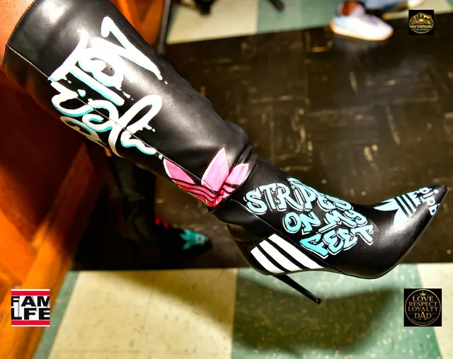 Hand-painted stiletto boot with three stripes and a trefoil