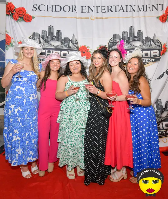 Six friends in spring dresses at the SCHDOR Kentucky Derby backdrop